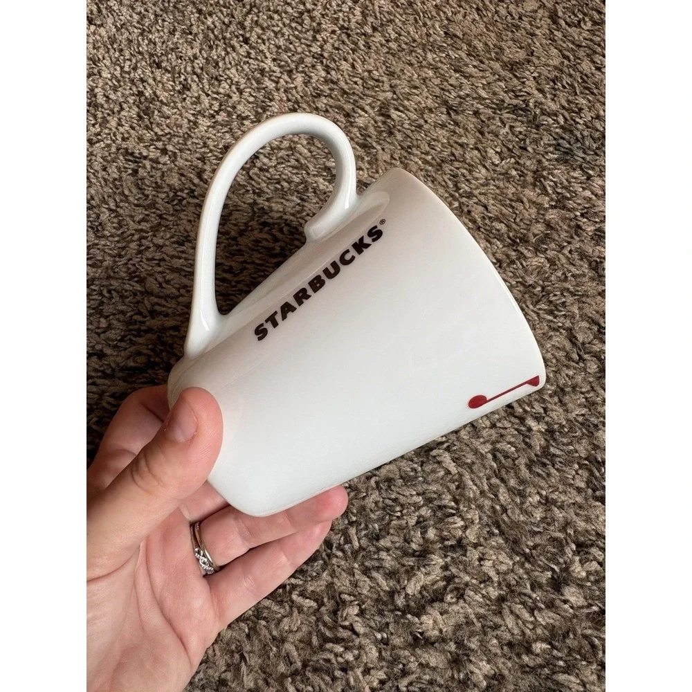 2012 Starbucks Mug with Bird Sitting on a Limb Singing Red & Blue Notes